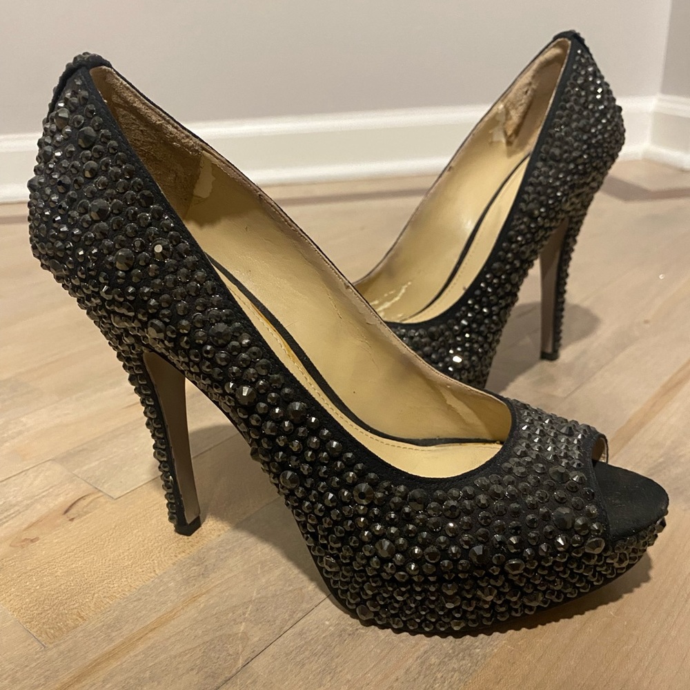 Black bejeweled Enzo Angiolini platform pumps.